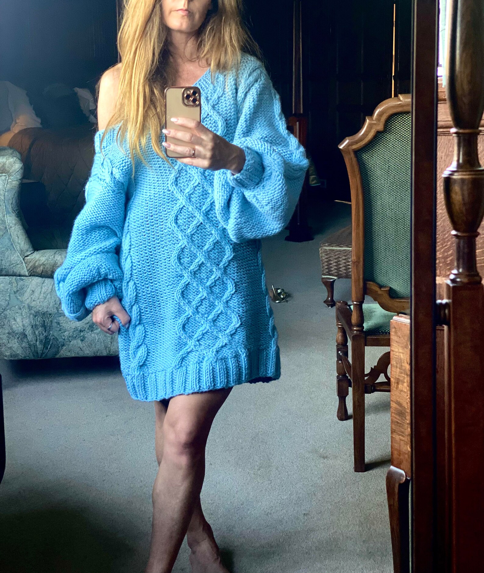 Hand-knitted wool sweater dress: light blue, oversized, with a cable-knit pattern.