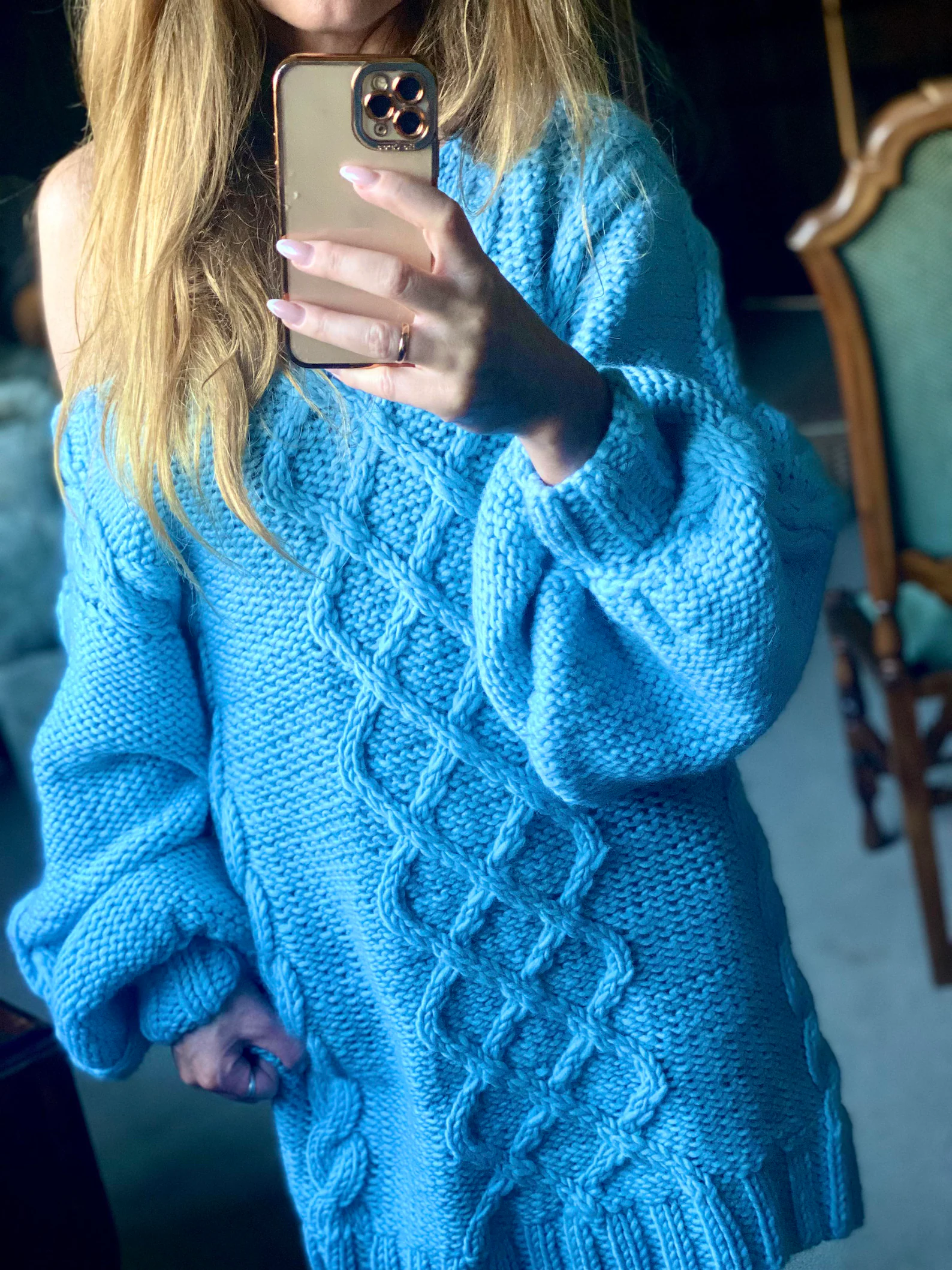 Hand-knitted wool sweater dress: light blue, oversized, with a cable-knit pattern.