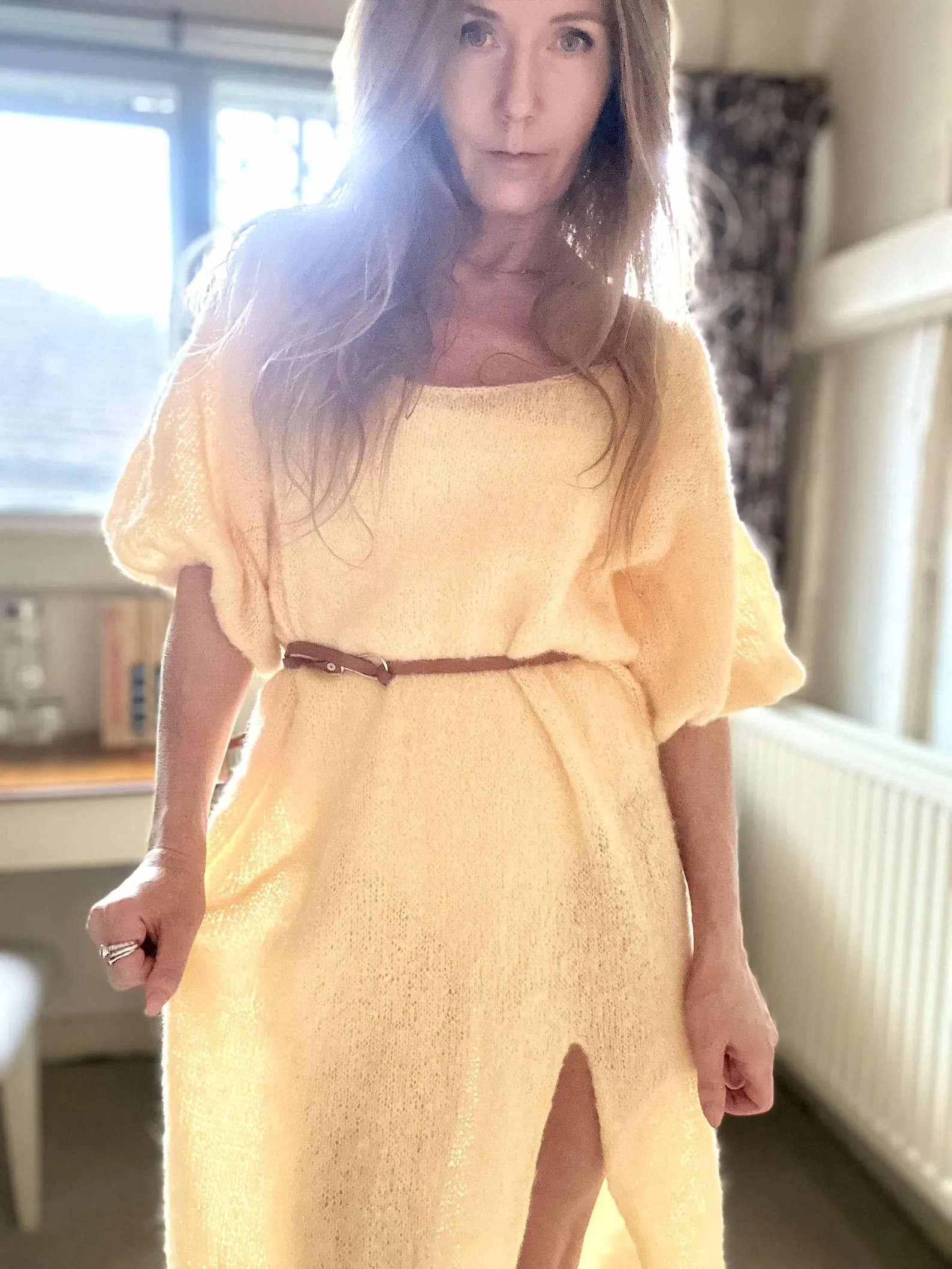 Hand-knitted alpaca midi dress with an off-the-shoulder neckline and a side slit; fits sizes XS–M.