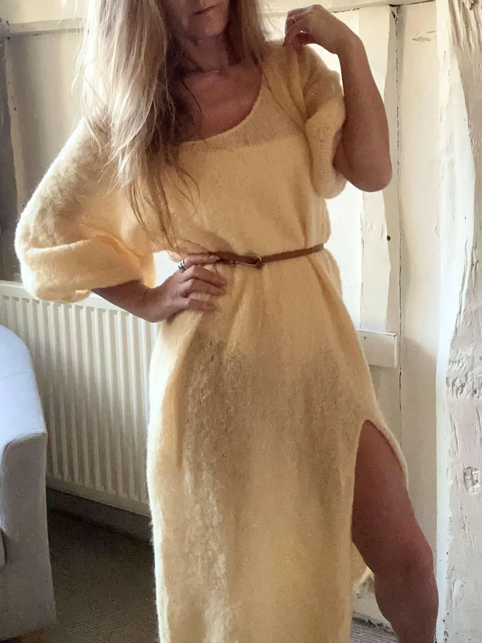 Hand-knitted alpaca midi dress with an off-the-shoulder neckline and a side slit; fits sizes XS–M.