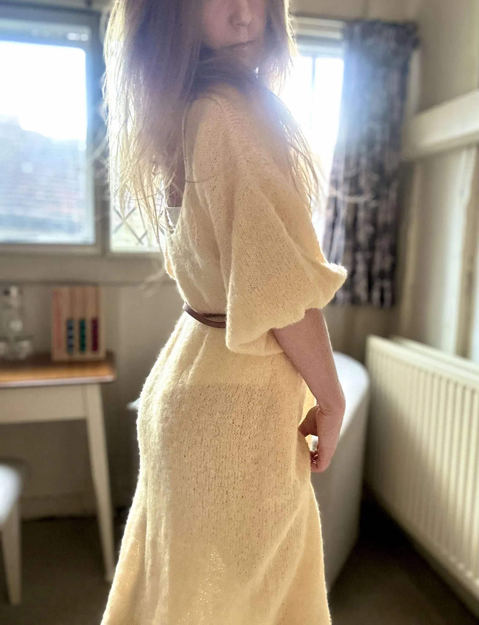 Hand-knitted alpaca midi dress with an off-the-shoulder neckline and a side slit; fits sizes XS–M.