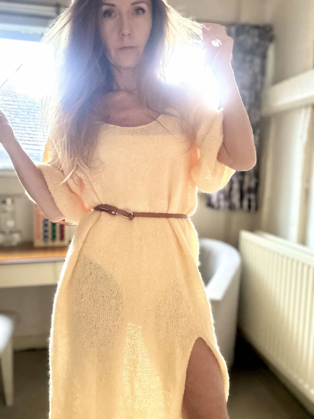 Hand-knitted alpaca midi dress with an off-the-shoulder neckline and a side slit; fits sizes XS–M.